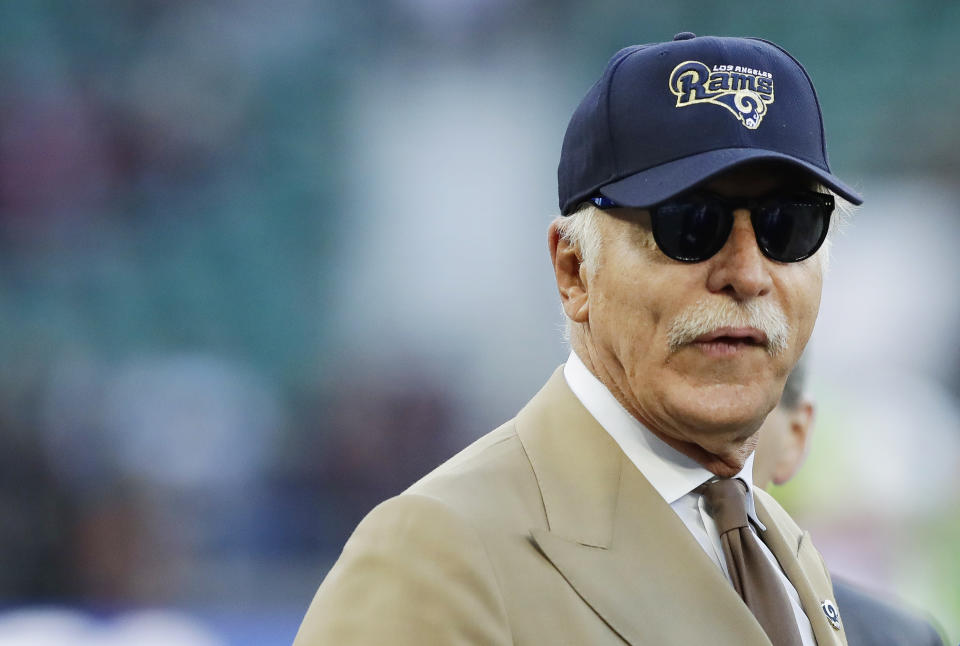 Stan Kroenke, owner of the Los Angeles Rams and main shareholder of English Premier League football club Arsenal, stands on the pitch before an NFL football game against the Arizona Cardinals at Twickenham Stadium in London on Sunday 22 October 2017 (AP Photo / Matt Dunham)